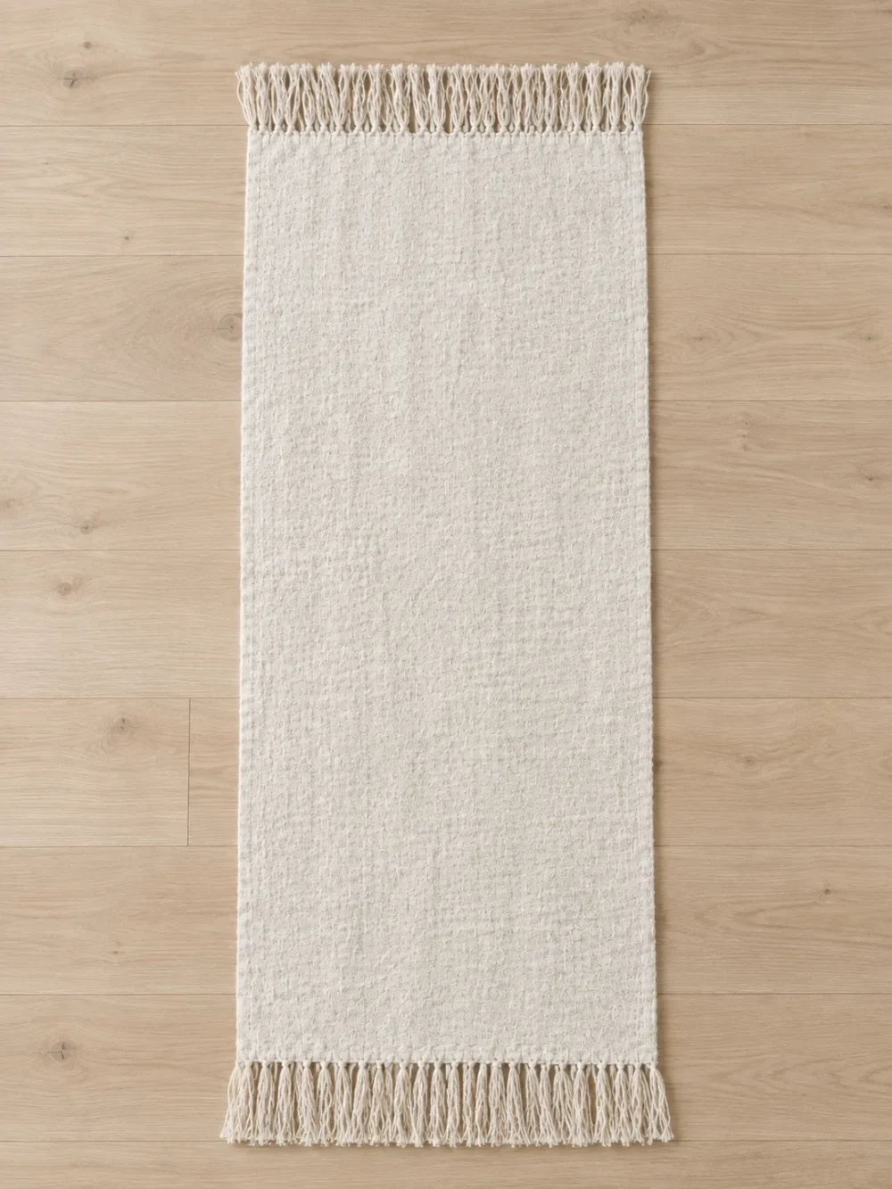 Drift Fringe Bed Runner in Chalk, laid flat, full length