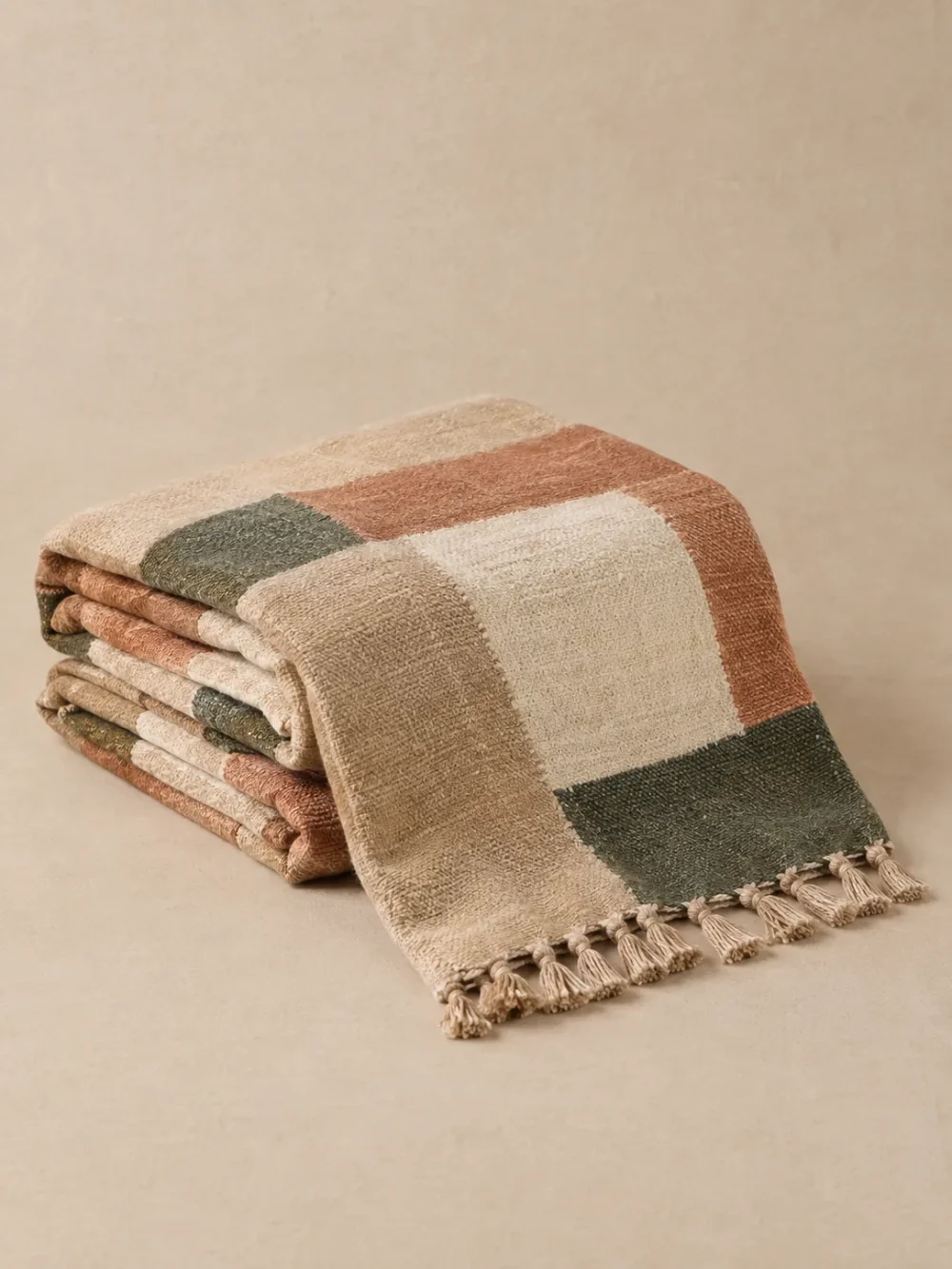 Dune Block Stripe Throw in Sand, folded, showing the edge finish