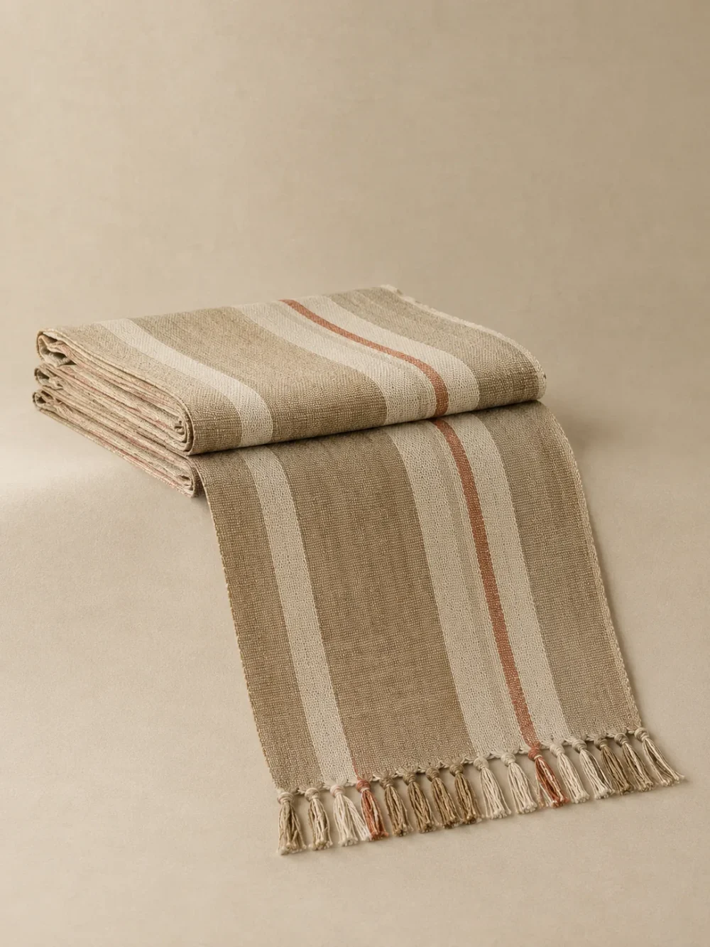 Dune Stripe Bed Runner in Sand, folded, showing the edge finish