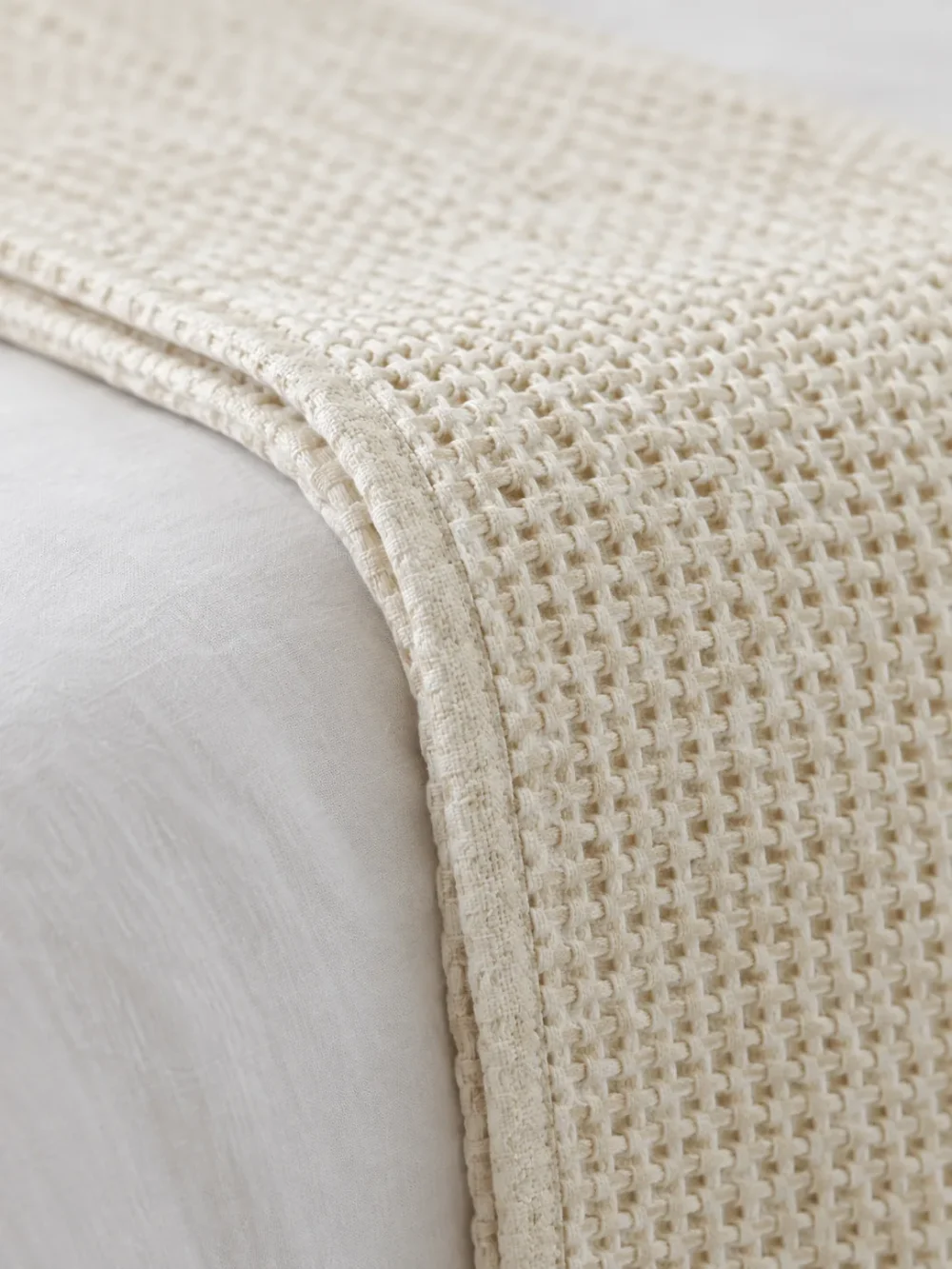 Ebb Waffle Bed Runner in Chalk, close-up of the end and edge