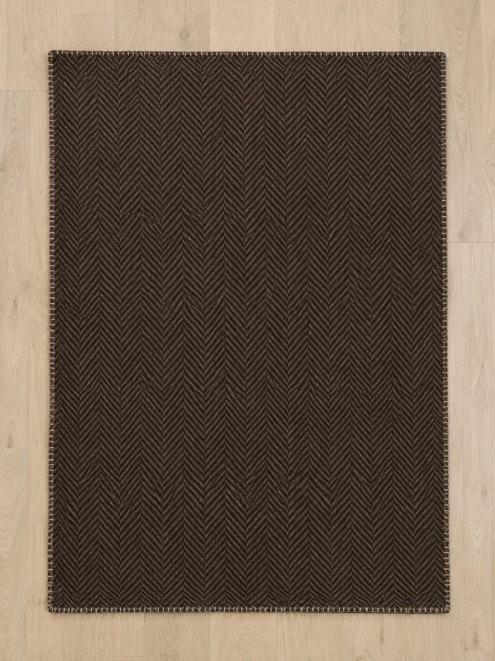 Fell Herringbone Throw in Peat, laid flat, full size