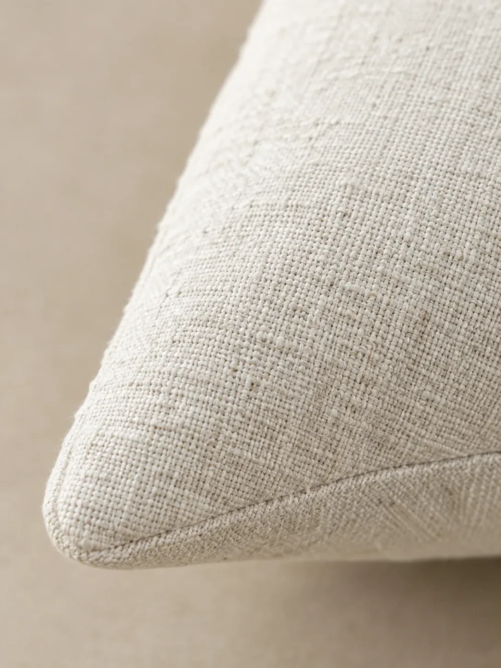 Harlow Button Cushion Cover in Chalk, close-up of the weave and edge
