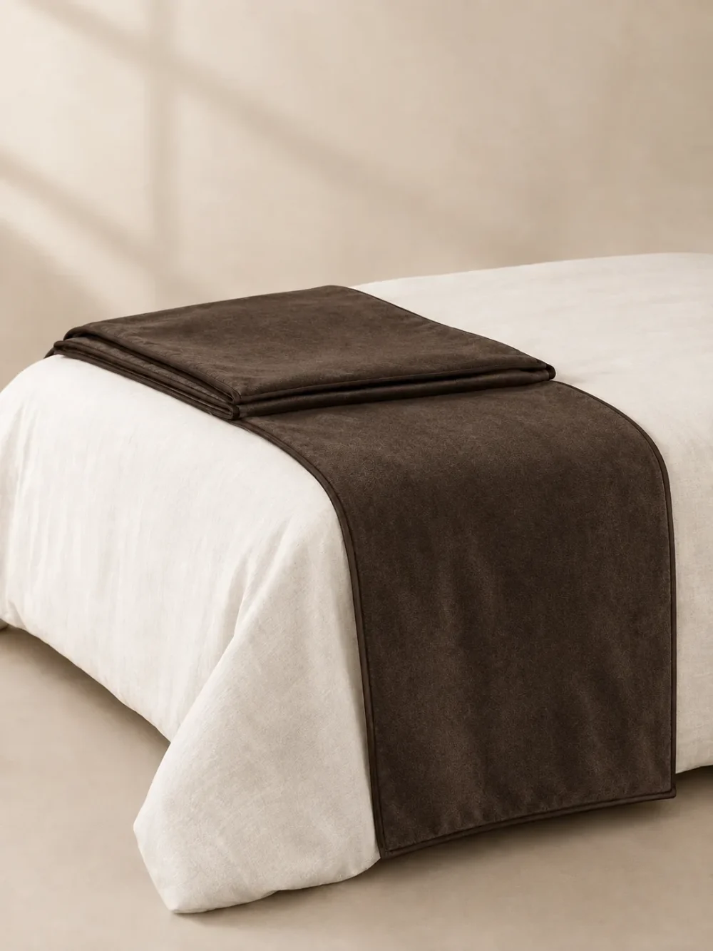 Hush Velvet Bed Runner in Peat, folded, showing the edge finish
