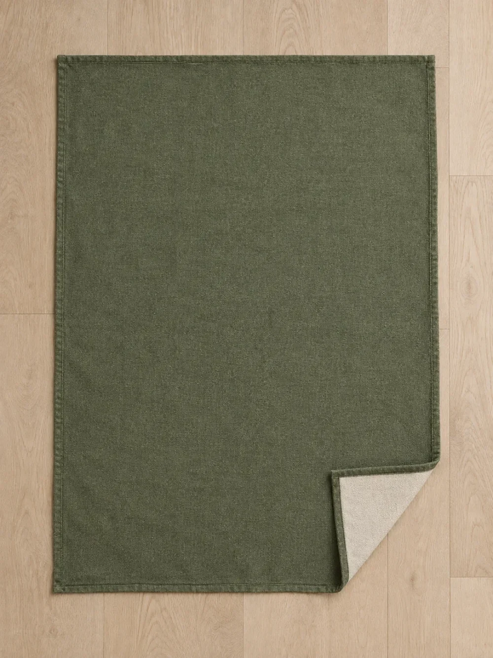 Kelp Reversible Throw in Moss, laid flat, full size