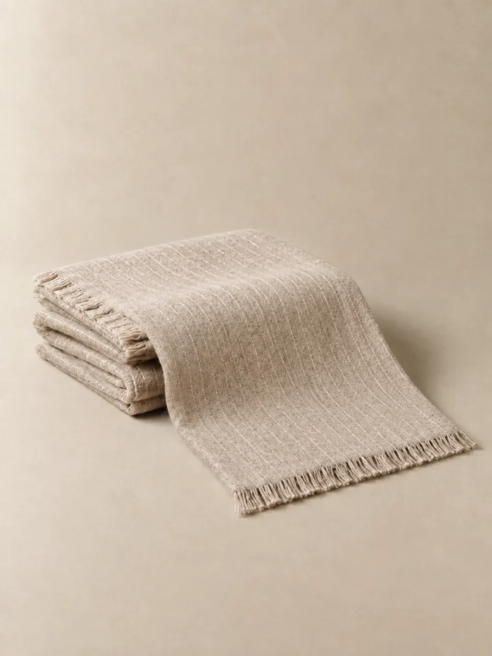 Lull Lap Throw in Oat, folded, showing the edge finish