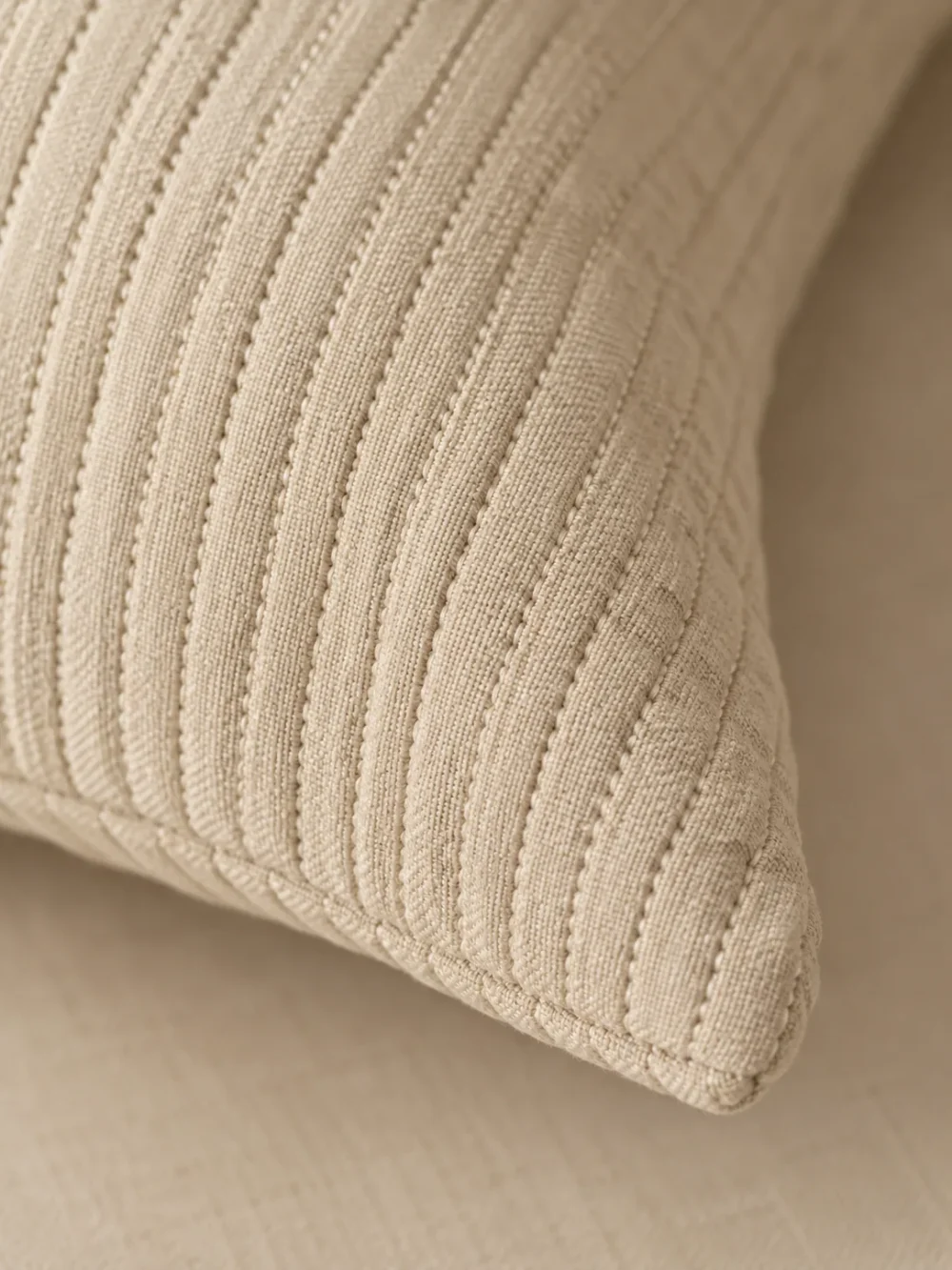 Lull Pintuck Cushion Cover in Sand, close-up of the weave and edge