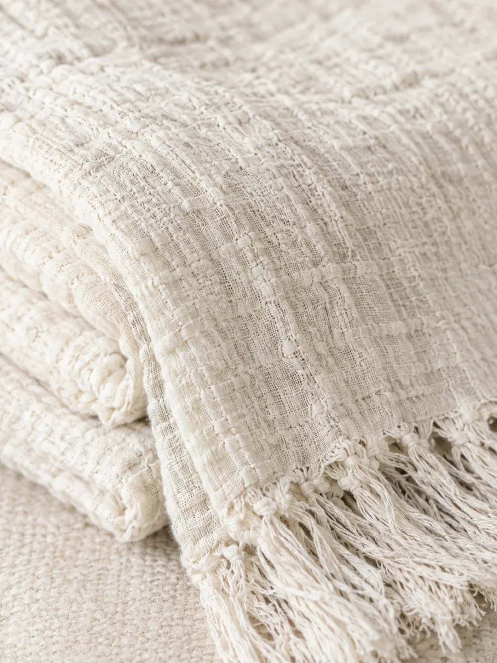 Mist Gauze Throw in Chalk, close-up of the weave and edge