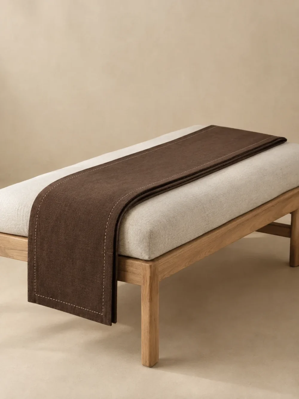 Nook Narrow Runner in Peat, folded, showing the edge finish