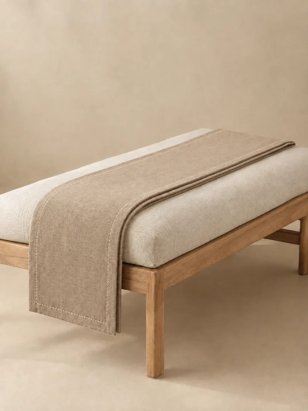 Nook Narrow Runner in Sand, folded, showing the edge finish