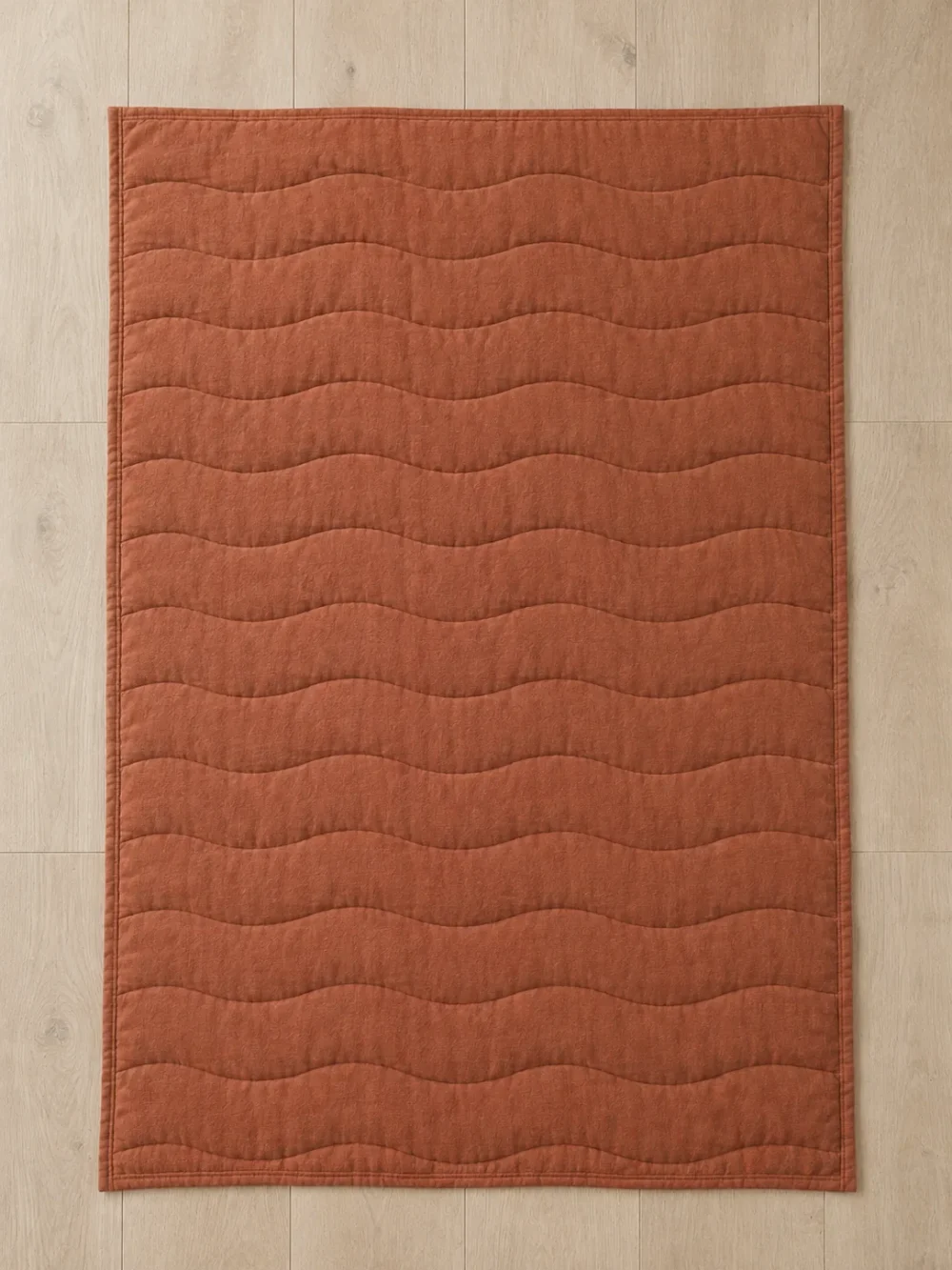 Swell Quilted Throw in Clay, laid flat, full size