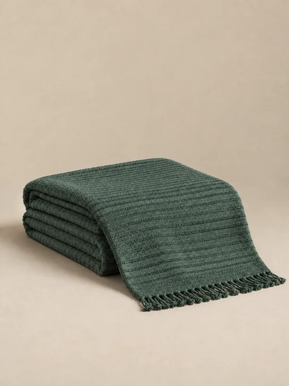 Tide Hollow Rib Throw in Fjord, folded, showing the edge finish