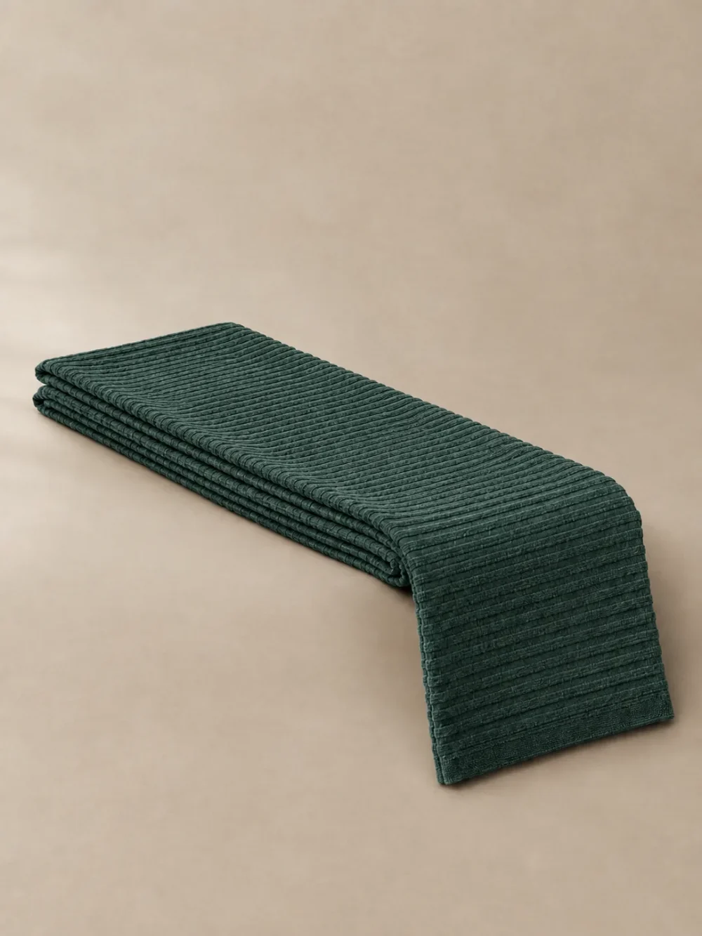 Tide Rib Bed Runner in Fjord, folded, showing the edge finish